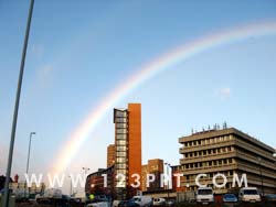 Rainbow Over City Photo Image
